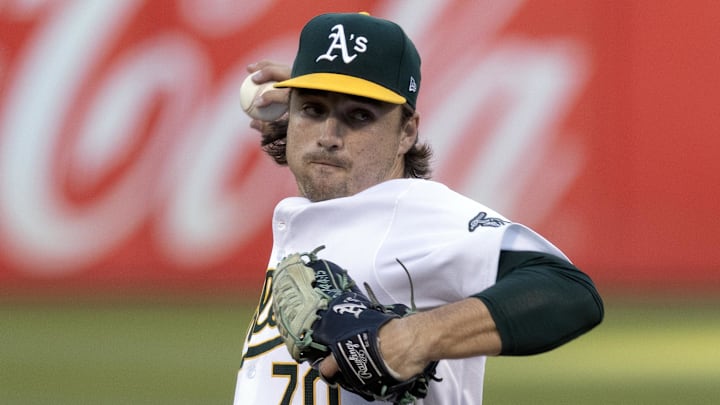 Sep 3, 2024; Oakland, California, USA; Oakland Athletics starting pitcher J.T. Ginn (70) delivers a pitch against the Seattle Mariners during the first inning at Oakland-Alameda County Coliseum. Mandatory Credit: D. Ross Cameron-Imagn Images