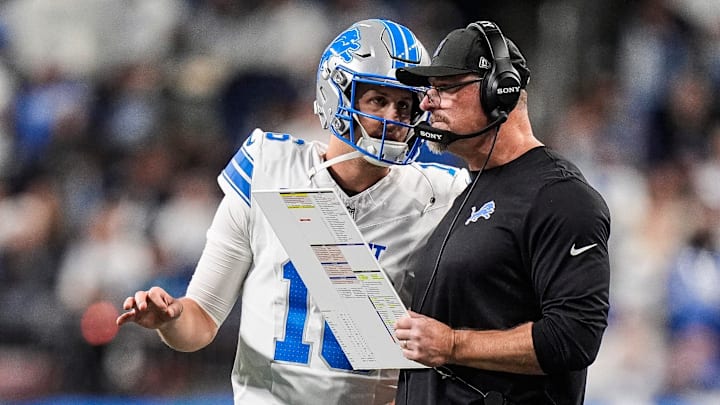Detroit Lions quarterback Jared Goff (16) talks to head coach Dan Campbell before a play against Dallas Cowboys during the second half at Ford Field in Detroit on Thursday, Dec. 4, 2025.