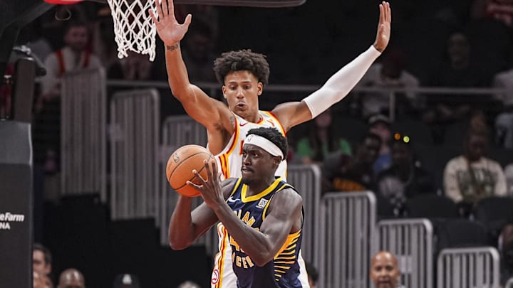 Oct 8, 2024; Atlanta, Georgia, USA; Indiana Pacers forward Pascal Siakam (43) is guarded by Atlanta Hawks forward Jalen Johnson (1) during the first half at State Farm Arena. Mandatory Credit: Dale Zanine-Imagn Images
