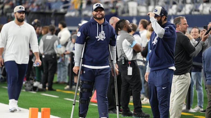 Dallas Cowboys quarterback Dak Prescott stands on crutches before the game against the New York Giants. Dallas Cowboys quarterback Dak Prescott stands on crutches before the game against the New York Giants.