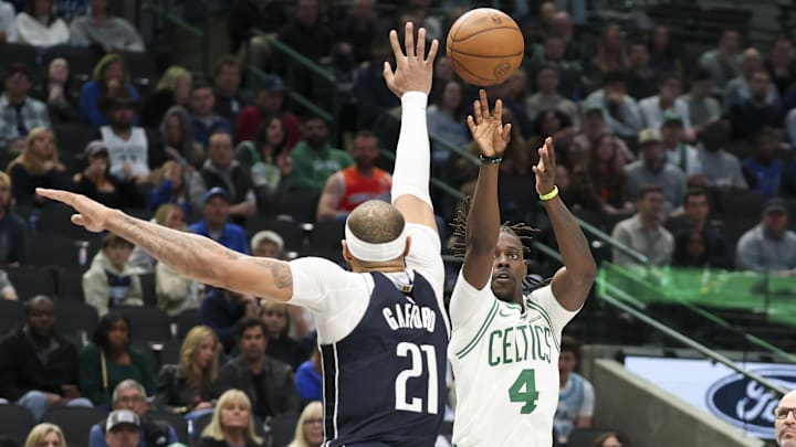 Jan 25, 2025; Dallas, Texas, USA; Boston Celtics guard Jrue Holiday (4) shoots over Dallas Mavericks center Daniel Gafford (21) during the second half at American Airlines Center. Mandatory Credit: Kevin Jairaj-Imagn Images