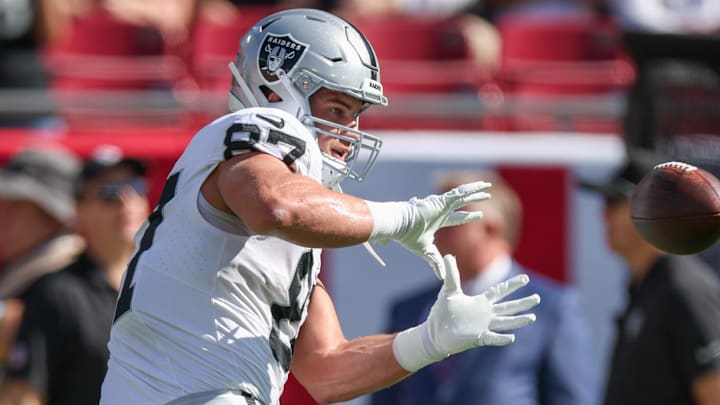 Dec 8, 2024; Tampa, Florida, USA; Las Vegas Raiders tight end Michael Mayer (87) warms up before a game against the Tampa Bay Buccaneers at Raymond James Stadium. Mandatory Credit: Nathan Ray Seebeck-Imagn Images