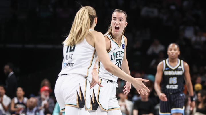 May 23, 2024; Brooklyn, New York, USA;  New York Liberty guard Sabrina Ionescu (20) celebrates with guard Ivana Dojkic (18) at the end of the first quarter against the Chicago Sky at Barclays Center.