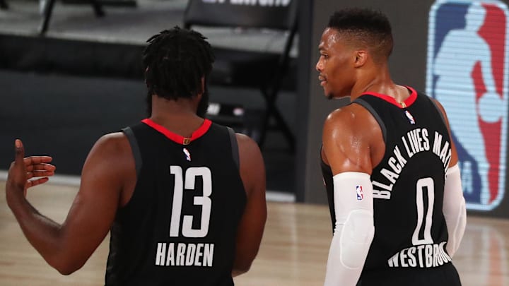 Sep 8, 2020; Lake Buena Vista, Florida, USA; Houston Rockets guard James Harden (13) and guard Russell Westbrook (0) talk during the first half of game three in the second round of the 2020 NBA Playoffs against the Los Angeles Lakers at AdventHealth Arena. Mandatory Credit: Kim Klement-Imagn Images