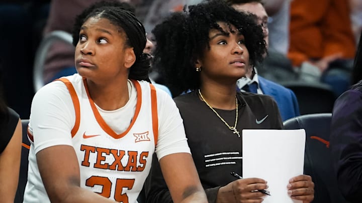 Texas Longhorns forward Madison Booker (35) and guard Rori Harmon (3) sit on the bench together in the second half of the Longhorns' game against the Kansas Jayhawks at the Moody Center in Austin, Jan 16, 2024. Texas won the game 91-56.