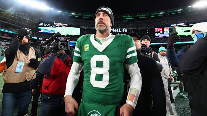 Jan 5, 2025; East Rutherford, New Jersey, USA; New York Jets quarterback Aaron Rodgers (8) walks on the field after the Jets win over the Miami Dolphins at MetLife Stadium. Mandatory Credit: Ed Mulholland-Imagn Images Jan 5, 2025; East Rutherford, New Jersey, USA; New York Jets quarterback Aaron Rodgers (8) walks on the field after the Jets win over the Miami Dolphins at MetLife Stadium. Mandatory Credit: Ed Mulholland-Imagn Images