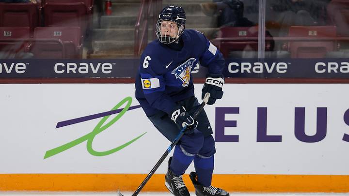 uho Piiparinen #6 of Finland skates with the puck during the Preliminary Round - Group B, Game 10 Finland vs Latvia - 2026 IIHF World Juniors
