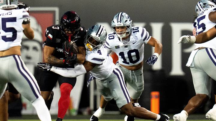 Kansas State Wildcats linebacker Mekhi Mason (4) tackles Cincinnati Bearcats running back Cole Tabb (3) in the first quarter of the NCAA football game between the Cincinnati Bearcats and Kansas State Wildcats at Nippert Stadium in Cincinnati on Saturday, September 26, 2026. Kansas State Wildcats linebacker Mekhi Mason (4) tackles Cincinnati Bearcats running back Cole Tabb (3) in the first quarter of the NCAA football game between the Cincinnati Bearcats and Kansas State Wildcats at Nippert Stadium in Cincinnati on Saturday, September 26, 2026.