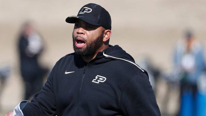 Purdue Boilermakers defensive backs coach Charles Clark yells down the field. Purdue Boilermakers defensive backs coach Charles Clark yells down the field.