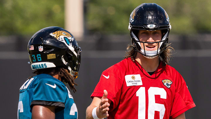 Jacksonville Jaguars running back LeQuint Allen (36) takes with Jacksonville Jaguars quarterback Trevor Lawrence (16) after an NFL training camp seventh session at the Miller Electric Center, Thursday, July 31, 2025, in Jacksonville, Fla. [Doug Engle/Florida Times-Union]