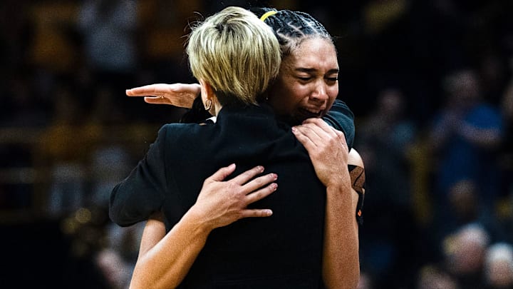 Iowa forward Hannah Stuelke (45) hugs Iowa head coach Jan Jensen as she comes off the court at the end of the basketball game against the Michigan Wolverines Feb. 22, 2026 at Carver-Hawkeye Arena in Iowa City, Iowa. Iowa forward Hannah Stuelke (45) hugs Iowa head coach Jan Jensen as she comes off the court at the end of the basketball game against the Michigan Wolverines Feb. 22, 2026 at Carver-Hawkeye Arena in Iowa City, Iowa.