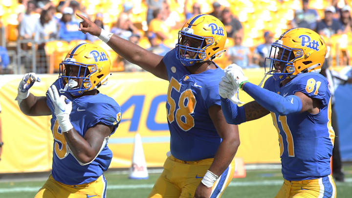 Sep 25, 2021; Pittsburgh, Pennsylvania, USA; Pittsburgh Panthers running back Rodney Hammnd Jr. (9) reacts after scoring his third touchdown of the game as offensive lineman Terrence Moore (58) and wide receiver Jaden Bradley (81) join in against the New Hampshire Wildcats during the third quarter at Heinz Field. Pittsburgh won 77-7. Mandatory Credit: Charles LeClaire-Imagn Images Sep 25, 2021; Pittsburgh, Pennsylvania, USA; Pittsburgh Panthers running back Rodney Hammnd Jr. (9) reacts after scoring his third touchdown of the game as offensive lineman Terrence Moore (58) and wide receiver Jaden Bradley (81) join in against the New Hampshire Wildcats during the third quarter at Heinz Field. Pittsburgh won 77-7. Mandatory Credit: Charles LeClaire-Imagn Images