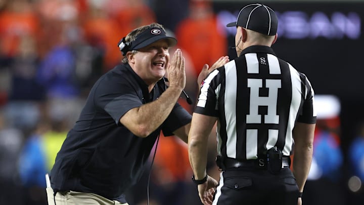 Oct 11, 2025; Auburn, Alabama, USA;  Georgia Bulldogs head coach Kirby Smart tries to tell an official that he did not call a time out during the fourth quarter against the Auburn Tigers at Jordan-Hare Stadium. Mandatory Credit: John Reed-Imagn Images