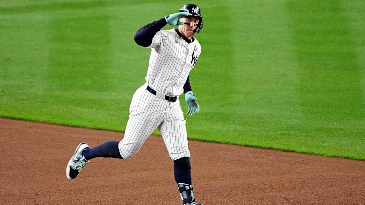 Oct 30, 2024; New York, New York, USA; New York Yankees outfielder Aaron Judge (99) celebrates after hitting a two run home run during the first inning against the Los Angeles Dodgers in game four of the 2024 MLB World Series at Yankee Stadium. Mandatory Credit: Robert Deutsch-Imagn Images
