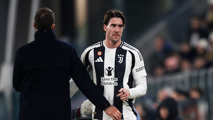 Dusan Vlahovic (R) of Juventus FC hugs Thiago Motta, head...