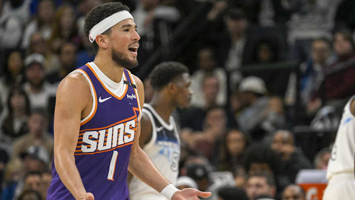 Nov 17, 2024; Minneapolis, Minnesota, USA;  Phoenix Suns guard Devin Booker (1) reacts after being called for a foul against the Minnesota Timberwolves during the fourth quarter at Target Center. Mandatory Credit: Nick Wosika-Imagn Images