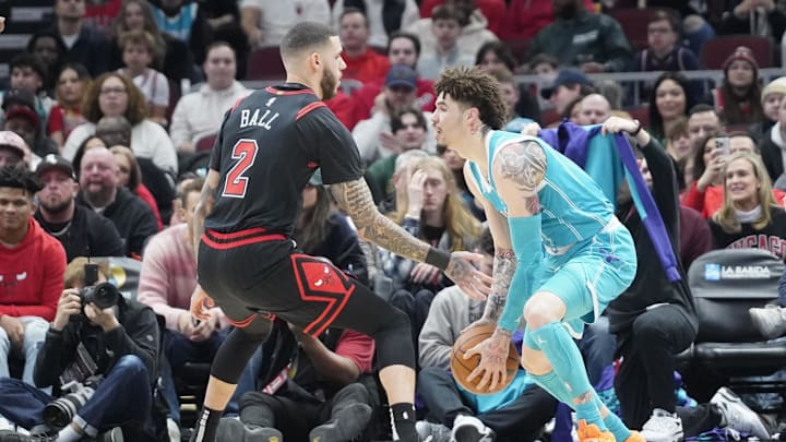Jan 17, 2025; Chicago, Illinois, USA; Chicago Bulls guard Lonzo Ball (2) defends Charlotte Hornets guard LaMelo Ball (1) during the first quarter at United Center. Mandatory Credit: David Banks-Imagn Images