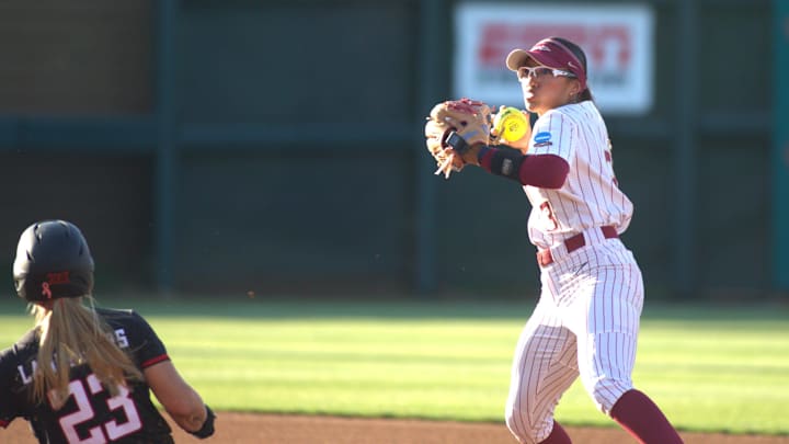 Florida State softball's Isa Torres (#3) turns a double play against Texas Tech in the NCAA Super Regionals