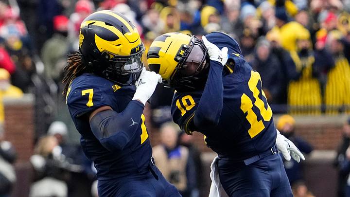 Michigan Wolverines defensive back TJ Metcalf (7) and defensive back Zeke Berry (10) celebrate during the NCAA football game against the Ohio State Buckeyes at Michigan Stadium in Ann Arbor, Mich. on Nov. 29, 2025.