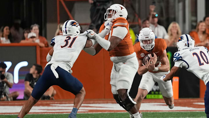 Sep 14, 2024; Austin, Texas, USA; Texas Longhorns offensive lineman Andre Cojoe (77) blocks for running back Colin Page (27) during the second half against the Texas-San Antonio Roadrunners at Darrell K Royal-Texas Memorial Stadium. Mandatory Credit: Scott Wachter-Imagn Images