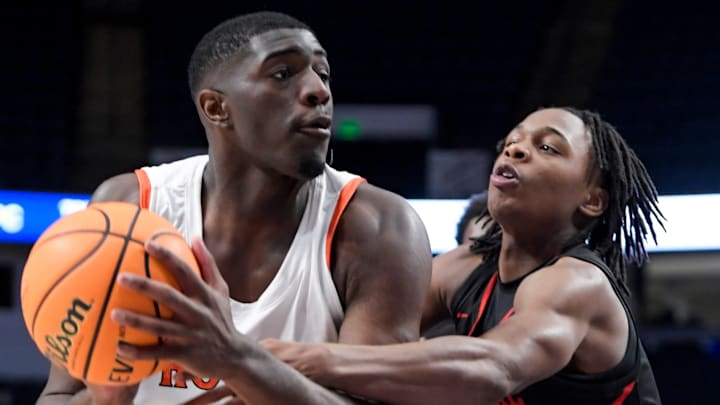 Central-Phenix City's Ty'jor Cooper (5) defends against Hoover's DeWayne Brown (55) during their AHSAA Class 7A semi-final game at Legacy Arena in Birmingham, Ala., on Thursday April 29, 2024. Central-Phenix City's Ty'jor Cooper (5) defends against Hoover's DeWayne Brown (55) during their AHSAA Class 7A semi-final game at Legacy Arena in Birmingham, Ala., on Thursday April 29, 2024.