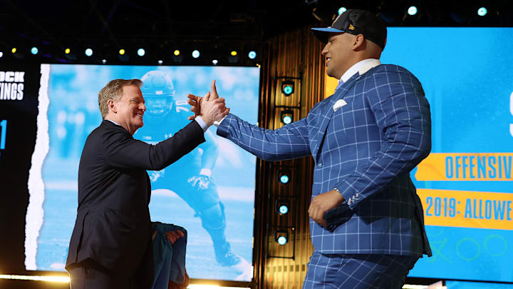 Former Northwestern tackle Rashawn Slater (right) proved to everyone last year that he was the clear top choice after an All-Pro rookie season. 