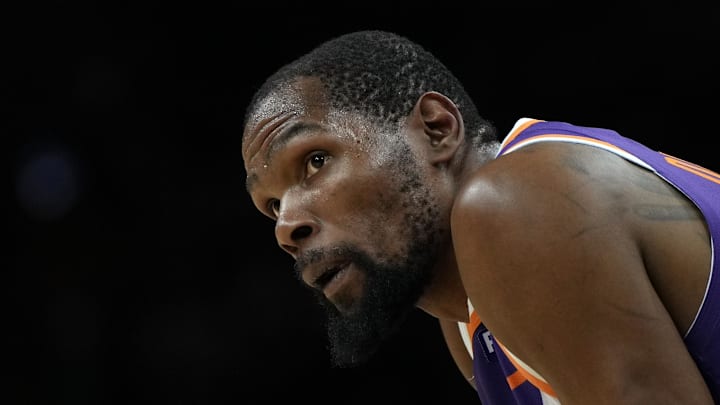 Mar 17, 2025; Phoenix, Arizona, USA; Phoenix Suns forward Kevin Durant (35) during a timeout in the second half against the Toronto Raptors at Footprint Center. Mandatory Credit: Rick Scuteri-Imagn Images