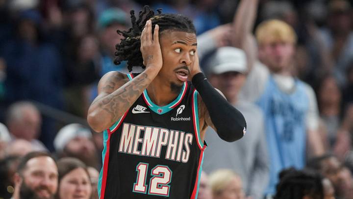 Grizzlies' Ja Morant (12) reacts after making a 3-pointer during the home opener against the New Orleans Pelicans at FedExForum on October 22, 2025. Grizzlies' Ja Morant (12) reacts after making a 3-pointer during the home opener against the New Orleans Pelicans at FedExForum on October 22, 2025.