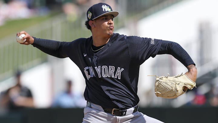 New York Yankees pitcher Carlos Lagrange (84) throws a pitch against the Minnesota Twins in the fourth inning during spring training at Lee Health Sports Complex/Hammond Stadium.