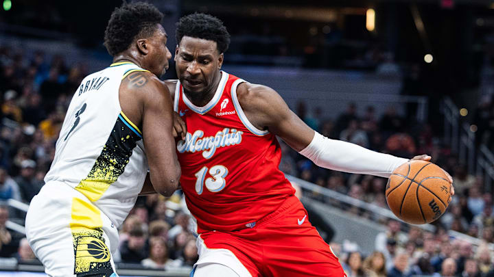 Feb 20, 2025; Indianapolis, Indiana, USA; Memphis Grizzlies forward Jaren Jackson Jr. (13) dribbles the ball while Indiana Pacers center Thomas Bryant (3) defends in the first half at Gainbridge Fieldhouse. Mandatory Credit: Trevor Ruszkowski-Imagn Images Feb 20, 2025; Indianapolis, Indiana, USA; Memphis Grizzlies forward Jaren Jackson Jr. (13) dribbles the ball while Indiana Pacers center Thomas Bryant (3) defends in the first half at Gainbridge Fieldhouse. Mandatory Credit: Trevor Ruszkowski-Imagn Images