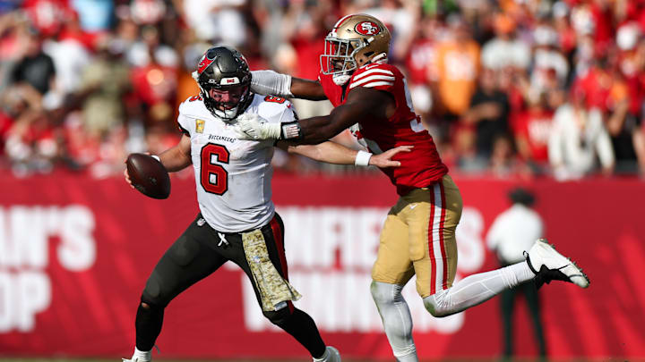 Nov 10, 2024; Tampa, Florida, USA; Tampa Bay Buccaneers quarterback Baker Mayfield (6) is pressured by San Francisco 49ers defensive end Leonard Floyd (56) in the fourth quarter at Raymond James Stadium. Mandatory Credit: Nathan Ray Seebeck-Imagn Images Nov 10, 2024; Tampa, Florida, USA; Tampa Bay Buccaneers quarterback Baker Mayfield (6) is pressured by San Francisco 49ers defensive end Leonard Floyd (56) in the fourth quarter at Raymond James Stadium. Mandatory Credit: Nathan Ray Seebeck-Imagn Images