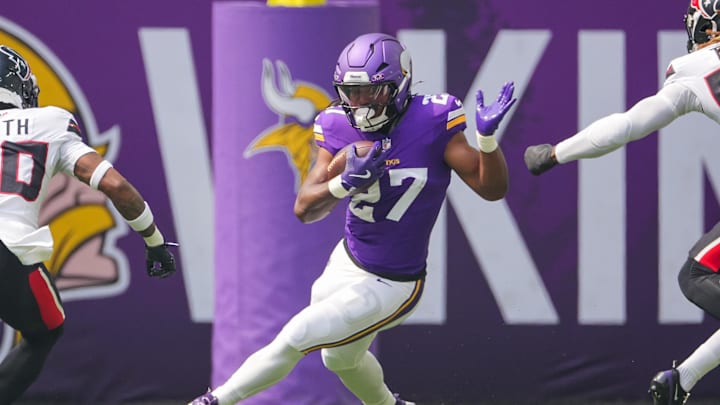 Minnesota Vikings running back Jordan Mason (27) runs with the ball against the Houston Texans in the first quarter at U.S. Bank Stadium. Minnesota Vikings running back Jordan Mason (27) runs with the ball against the Houston Texans in the first quarter at U.S. Bank Stadium.