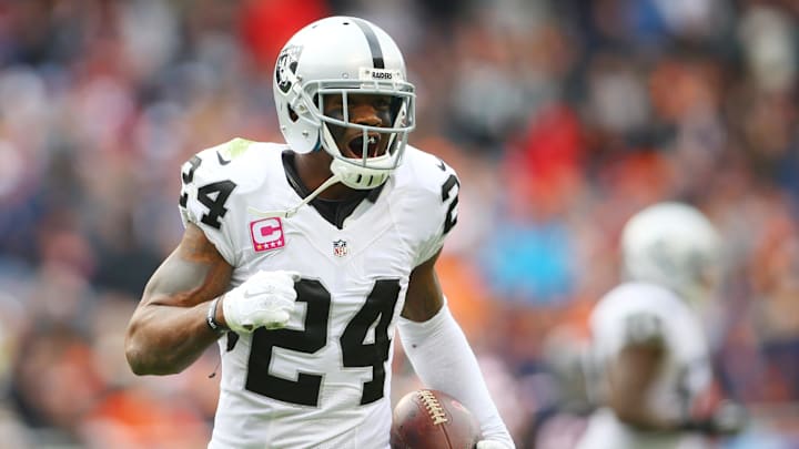 Oct 4, 2015; Chicago, IL, USA; Oakland Raiders free safety Charles Woodson (24) celebrates after an interception against the Chicago Bears during the second half at Soldier Field. Mandatory Credit: Jerry Lai-Imagn Images