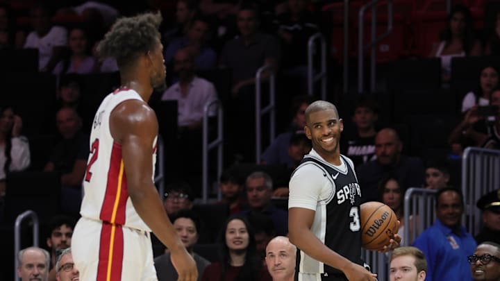 Chris Paul and Jimmy Butler talked during a preseason game.