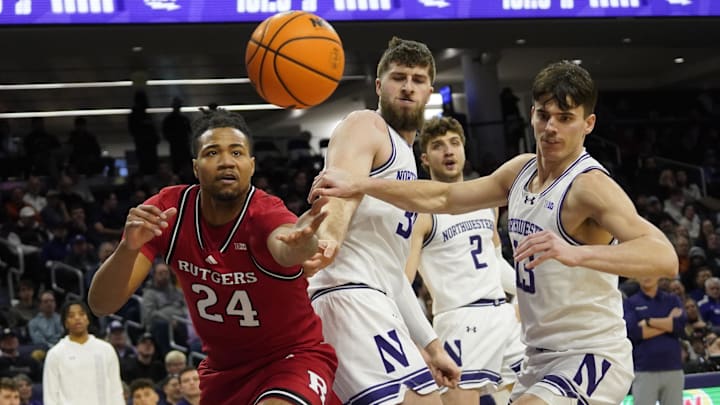 Jan 29, 2025; Evanston, Illinois, USA; Rutgers Scarlet Knights center Lathan Sommerville (24) and Northwestern Wildcats guard Brooks Barnhizer (13) go for the ball during the first half at Welsh-Ryan Arena. Mandatory Credit: David Banks-Imagn Images