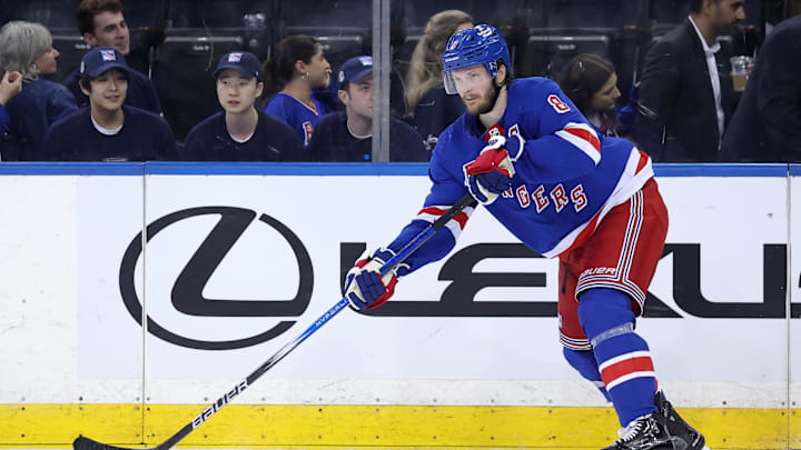 May 22, 2024; New York, New York, USA; New York Rangers defenseman Jacob Trouba (8) controls the puck against the Florida Panthers during the third period of game one of the Eastern Conference Final of the 2024 Stanley Cup Playoffs at Madison Square Garden. Mandatory Credit: Brad Penner-USA TODAY Sports