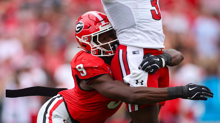Sep 6, 2025; Athens, Georgia, USA; Georgia Bulldogs linebacker Chris Cole (9) sacks Austin Peay Governors quarterback Chris Parson (3) in the first quarter at Sanford Stadium. Mandatory Credit: Brett Davis-Imagn Images