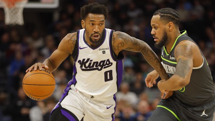 Mar 1, 2024; Minneapolis, Minnesota, USA; Sacramento Kings guard Malik Monk (0) works around Minnesota Timberwolves guard Monte Morris (23) in the first quarter at Target Center. Mandatory Credit: Bruce Kluckhohn-USA TODAY Sports Mar 1, 2024; Minneapolis, Minnesota, USA; Sacramento Kings guard Malik Monk (0) works around Minnesota Timberwolves guard Monte Morris (23) in the first quarter at Target Center. Mandatory Credit: Bruce Kluckhohn-USA TODAY Sports