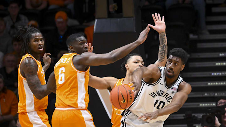 Feb 21, 2026; Nashville, Tennessee, USA;  Vanderbilt Commodores forward Ak Okereke (10) passes out of a double team from Tennessee Volunteers forward Dewayne Brown II (6) and guard Ja'kobi Gillespie (0)  during the first half at Memorial Gymnasium. Mandatory Credit: Steve Roberts-Imagn Images
