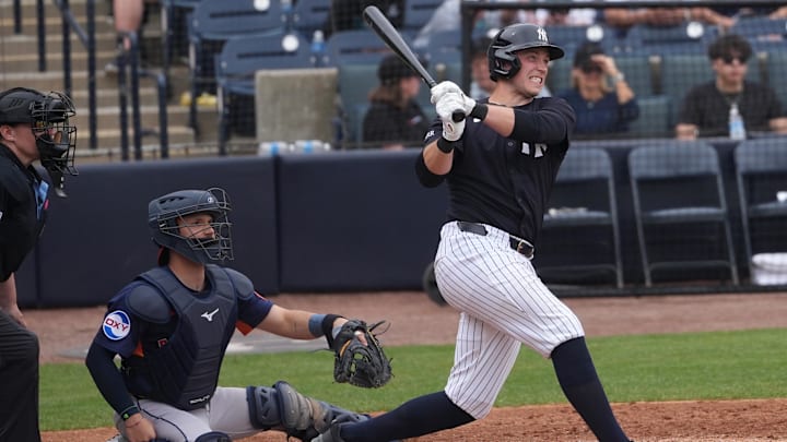 Mar 1, 2025; Tampa, Florida, USA; New York Yankees first base Ben Rice (93) hits a home run against the Houston Astros during the fourth inning at George M. Steinbrenner Field. 