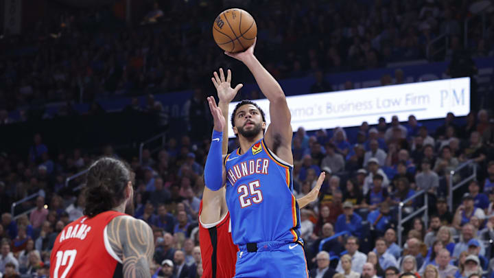 Oct 21, 2025; Oklahoma City, Oklahoma, USA; Oklahoma City Thunder guard Ajay Mitchell (25) shoots against the Houston Rockets during the first half at Paycom Center. Mandatory Credit: Alonzo Adams-Imagn Images