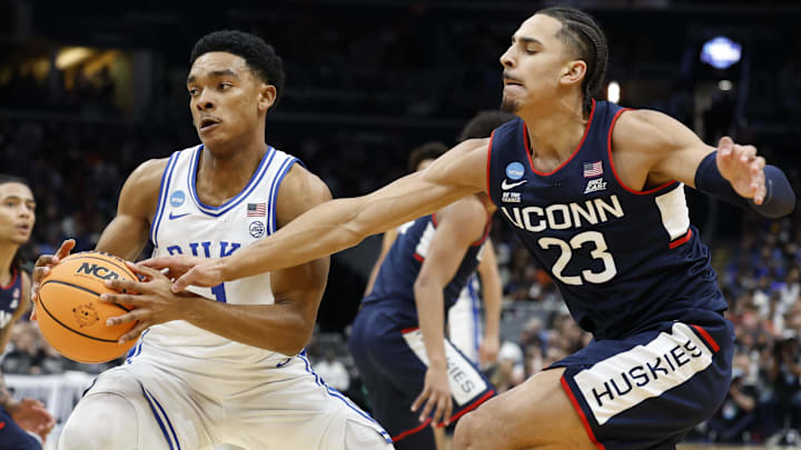 Duke Blue Devils guard Caleb Foster (1) and UConn Huskies forward Jayden Ross (23) Duke Blue Devils guard Caleb Foster (1) and UConn Huskies forward Jayden Ross (23)