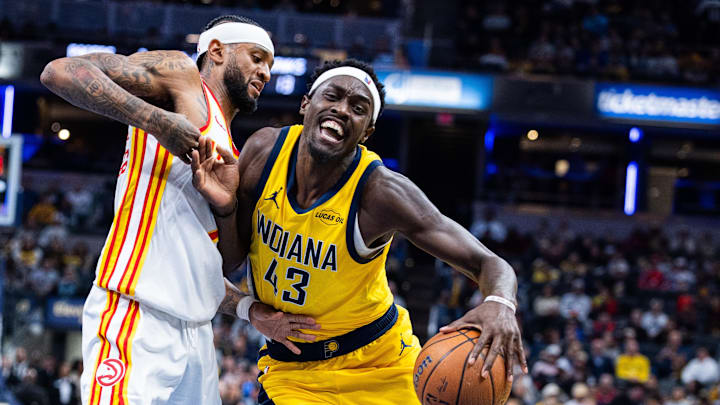 Oct 31, 2025; Indianapolis, Indiana, USA; Indiana Pacers forward Pascal Siakam (43) dribbles the ball while Atlanta Hawks guard Nickeil Alexander-Walker (7) defends in the first half at Gainbridge Fieldhouse. Mandatory Credit: Trevor Ruszkowski-Imagn Images