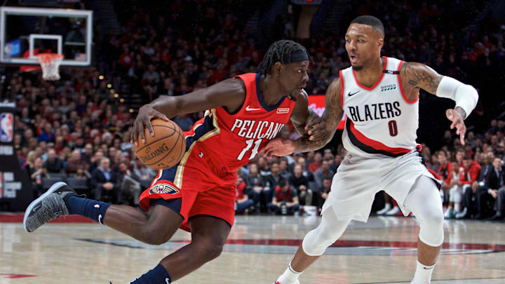 Nov 1, 2018; Portland, OR, USA; New Orleans Pelicans guard Jrue Holiday (11) dribbles around Portland Trail Blazers guard Damian Lillard (0) during the first quarter at the Moda Center. Mandatory Credit: Craig Mitchelldyer-Imagn Images Nov 1, 2018; Portland, OR, USA; New Orleans Pelicans guard Jrue Holiday (11) dribbles around Portland Trail Blazers guard Damian Lillard (0) during the first quarter at the Moda Center. Mandatory Credit: Craig Mitchelldyer-Imagn Images