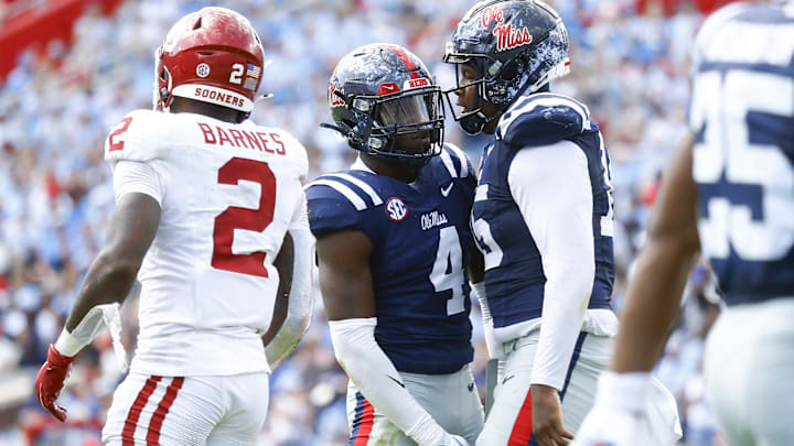 Ole Miss' Jared Ivey (15) reacts with Suntarine Perkins (4) after a sack during the first half against Oklahoma. 