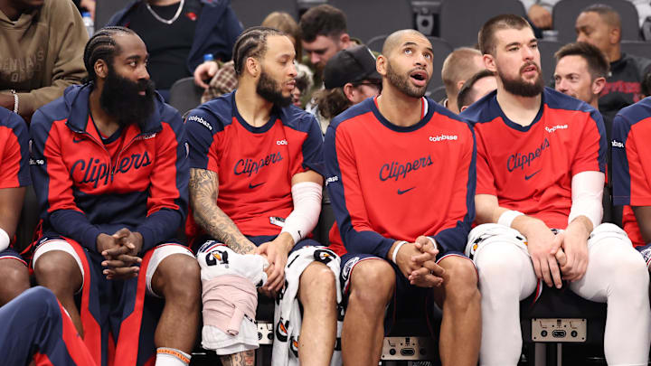 Dec 4, 2024; Inglewood, California, USA;  Los Angeles Clippers guard James Harden (1, left), guard Amir Coffey (7), forward Nicolas Batum (33) and center Ivica Zubac (40, right) watch from the bench during the second half against the Minnesota Timberwolves at Intuit Dome. Mandatory Credit: Kiyoshi Mio-Imagn Images