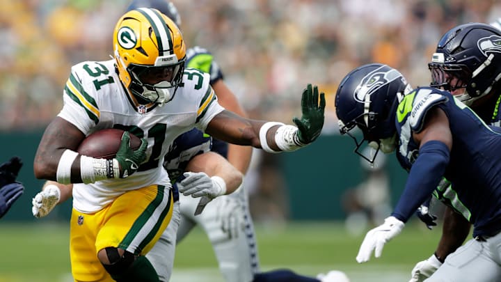 Green Bay Packers running back Emanuel Wilson (31) carries the ball during a preseason game against the Seattle Seahawks on Aug. 23, 2025, at Lambeau Field in Green Bay, Wis. The Packers defeated the Seahawks 20-7.