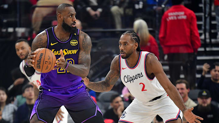 Jan 19, 2025; Inglewood, California, USA; Los Angeles Lakers forward LeBron James (23) moves the ball against Los Angeles Clippers forward Kawhi Leonard (2) during the first half at Intuit Dome. Mandatory Credit: Gary A. Vasquez-Imagn Images Jan 19, 2025; Inglewood, California, USA; Los Angeles Lakers forward LeBron James (23) moves the ball against Los Angeles Clippers forward Kawhi Leonard (2) during the first half at Intuit Dome. Mandatory Credit: Gary A. Vasquez-Imagn Images