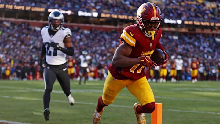 Dec 22, 2024; Landover, Maryland, USA; Washington Commanders wide receiver Terry McLaurin (17) catches a touchdown pass against Philadelphia Eagles cornerback Quinyon Mitchell (27) during the second quarter at Northwest Stadium. Mandatory Credit: Peter Casey-Imagn Images Dec 22, 2024; Landover, Maryland, USA; Washington Commanders wide receiver Terry McLaurin (17) catches a touchdown pass against Philadelphia Eagles cornerback Quinyon Mitchell (27) during the second quarter at Northwest Stadium. Mandatory Credit: Peter Casey-Imagn Images