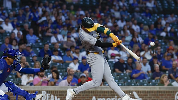 Sep 17, 2024; Chicago, Illinois, USA; Oakland Athletics outfielder Brent Rooker (25) singles against the Chicago Cubs during the first inning at Wrigley Field. Sep 17, 2024; Chicago, Illinois, USA; Oakland Athletics outfielder Brent Rooker (25) singles against the Chicago Cubs during the first inning at Wrigley Field.
